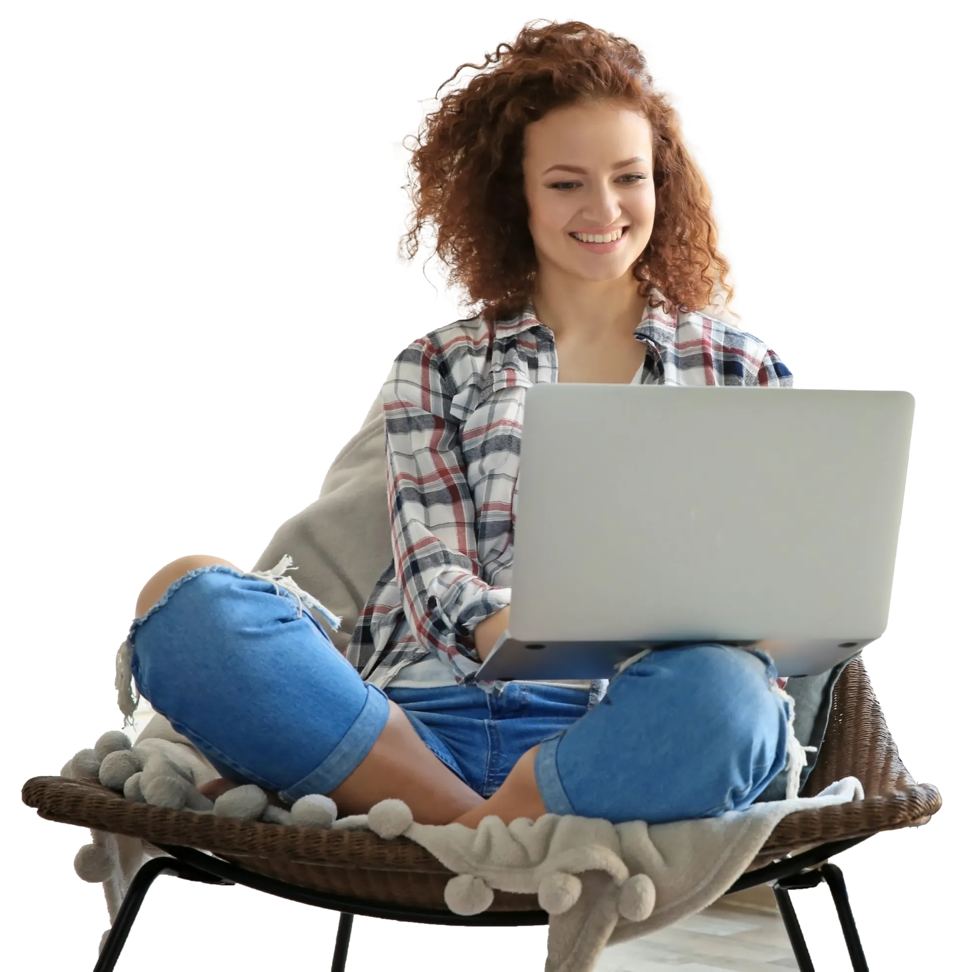Woman in comfortable chair using laptop